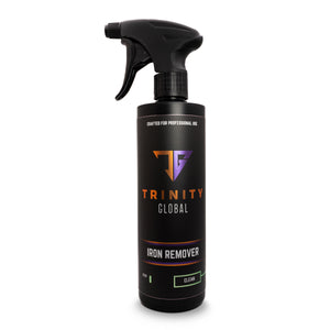 A black spray bottle labeled 'Trinity Global Iron Remover' with orange and purple text indicating the product is for professional use and made in the USA.