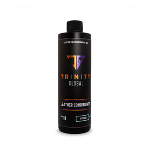A black spray bottle labeled 'Trinity Global Leather Conditions' with orange and white text indicating the product is for professional use and designed for leather conditions.